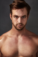 Fototapeta premium Serious about grooming. Cropped portrait of a handsome young man against a grey background.
