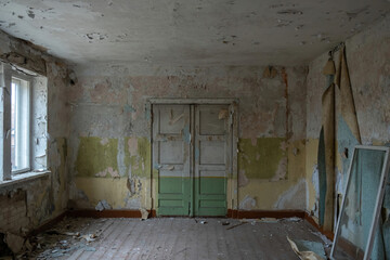 abandoned door interior with peeling paint