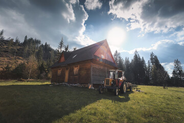 Fototapeta na wymiar tractor at the mountain house
