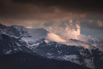 Fotobehang Tatra Tatra mountains covered with snow at sunset