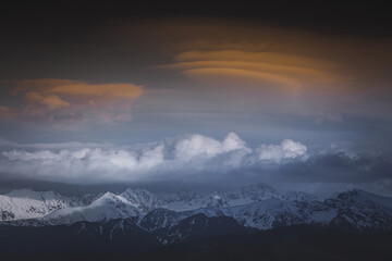 Fototapeta na wymiar Tatra mountains covered with snow at sunset