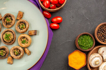 top view cooked mushrooms inside plate with seasonings on dark background dish mushrooms dinner cooking meal