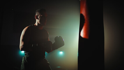 Boxer trains at the punch bag
