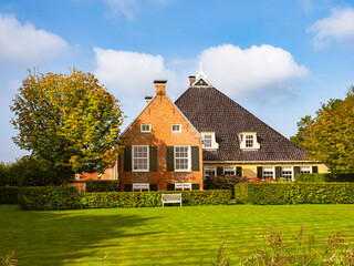 Frisian farmhouse in autumn near Langweer, Friesland, Netherlands