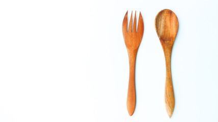 Wooden spoon and fork isolated on white background. Kitchen and cooking concept.
