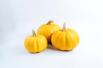 A group of fresh orange pumpkins is isolated on white background. Created with Generative AI Technology