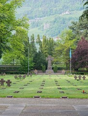 Merano, ItaIy - Apr 29, 2023: Austro-Hungarian, itaIian and german from first and second world war cemetery in Merano, ItaIy. Spring sunny day. Selective focus.