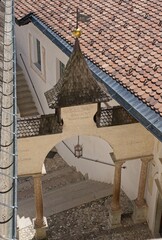 Coredo, ItaIy - Apr 29, 2023: The Sanctuary of San Romedio is situated on a steep rocky spur in the natural scenery of the Val di Non, Trentino-Alto Adige, ItaIy. Sunny spring day. Selective focus