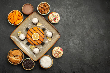 top view delicious little cake with coconut candies on dark-grey background cake dessert biscuit pie cookie tea
