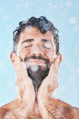 Fototapeta na wymiar Wellness, water or man in shower cleaning skin or washing face and body in morning grooming routine in studio. Blue background, hands or healthy male model with self care, self love or a happy smile