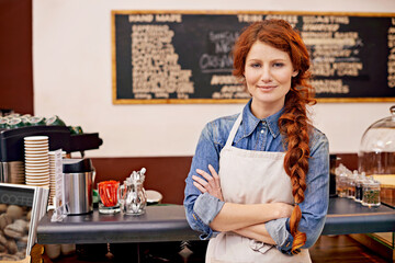 Portrait, woman and barista with arms crossed, cafe and happiness with startup success, business and growth. Face, female employee and happy entrepreneur in a coffee shop, restaurant and development