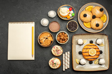 top view delicious little pie with cookies and cake on dark grey background cake tea biscuit cookie sweet