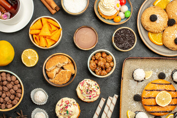 top view delicious little pie with cookies chips and cup of tea on a grey background cake tea biscuit cookie sweet