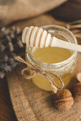 Wooden stick for honey close-up with honey