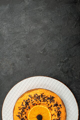 Obraz na płótnie Canvas top view delicious pie with chocolate chips and orange slices on dark floor pie dessert cake tea fruit biscuit