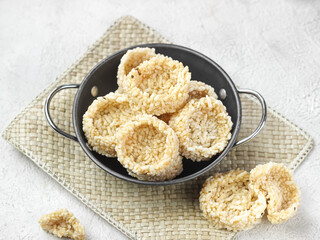 Rengginang Lorjuk is a thick traditional cracker made from round shaped sticky rice. Rengginang Lorjuk is special food from Madura