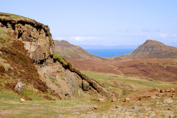 Landscape with blue ocean, blue sky and mountains on the isle of Skye