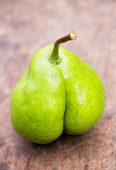 A pear looks like a botty, cellulite skin or weight loss diet concept with copy space