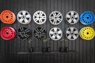 Different car rims. Rim pattern. Undercarriage element. Car decor. Auto repair shop design. Black background. Transport background.