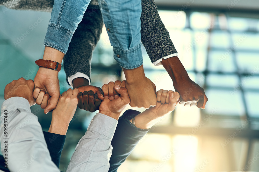 Poster the time to get growing is now. a group of unrecognizable businesspeople stacking fists.
