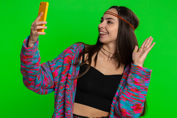 Woman blogger taking selfie vlog on smartphone, communicating video call online with family or...