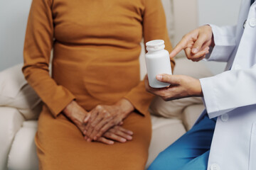 Elderly Asian female patients with cancer specialists meet by appointment to receive treatment advice for breast, cervical, lung cancer.