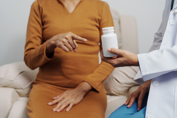 Elderly Asian female patients with cancer specialists meet by appointment to receive treatment advice for breast, cervical, lung cancer.