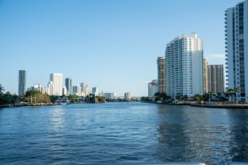 Fototapeta na wymiar wide capture of sunny isles in miami beach from a boat in the water showing the bay and intercoastal
