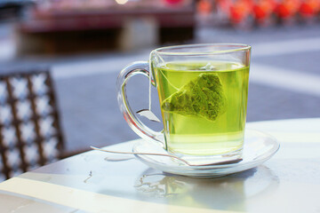 Hot green tea in a cafe