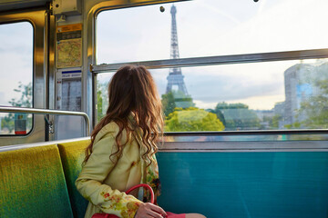 Beautiful young woman in Parisian metro - obrazy, fototapety, plakaty