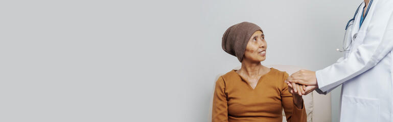 Elderly Asian female patients with cancer specialists meet by appointment to receive treatment...