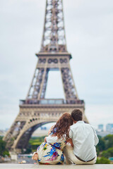 Fototapeta na wymiar Romantic loving couple having a date near the Eiffel tower