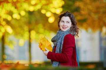 Beautiful young girl in autumn park