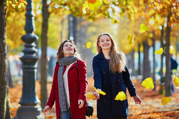 Two young girls on a sunny fall day