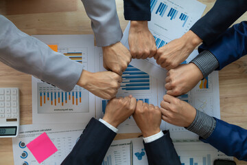  A group of businesspeople and investors meet to discuss market's success in past quarter. idea of setting up a marketing consulting team and working together as a team made it a success.
