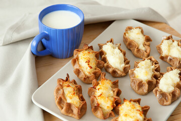 Traditional karelian pasties and cup of milk