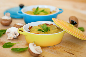 Delicious potato gratin in colorful ramekins