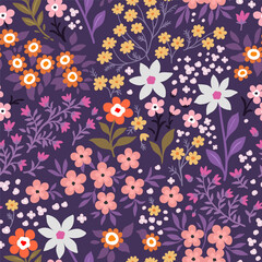 Seamless pattern. Vector flower design with cute wildflowers. Romantic abstract floral pattern on purple background. Illustrations of spring nature with pink, orange, white and purple flowers.
