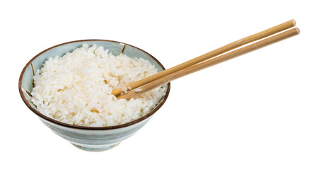 boiled rice in bowl with chopsticks cutout on white background