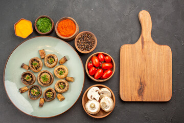 top view tasty mushrooms meal with fresh tomatoes and seasonings on a dark background dish dinner meal cooking mushroom