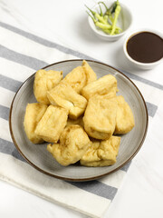 Tahu Petis is a typical Semarang snack, javanese traditional snack. Fried Tofu eaten with petis or processed food made from black shrimp paste smeared or inserted in the middle of tofu