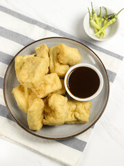 Tahu Petis is a typical Semarang snack, javanese traditional snack. Fried Tofu eaten with petis or processed food made from black shrimp paste smeared or inserted in the middle of tofu