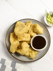 Tahu Petis is a typical Semarang snack, javanese traditional snack. Fried Tofu eaten with petis or processed food made from black shrimp paste smeared or inserted in the middle of tofu