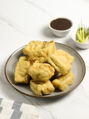 Tahu Petis is a typical Semarang snack, javanese traditional snack. Fried Tofu eaten with petis or processed food made from black shrimp paste smeared or inserted in the middle of tofu