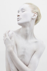 beautiful woman in white paint. beautiful nude girl