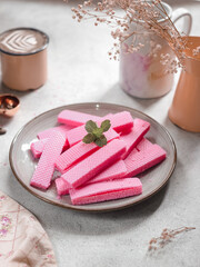 Wafers in ceramics plate. Wafers are crispy biscuits, thin, layered and chocolate contents, can also be used to decorate ice