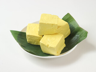Tahu kuning or raw yellow tofu is one of type traditional food in indonesia made from fermented soybeans