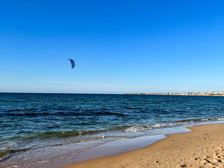 Kite surfer rides on the water in Staoueli, Algeria