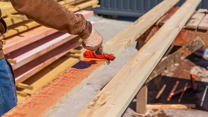 Treat the wooden board with an antiseptic. Selective focus.