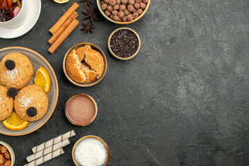 top view yummy cookies with cup of tea on dark background cake pie sugar dessert biscuit tea cookie